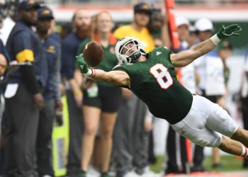 MIAMI GARDENS, FL - SEPTEMBER 23: University of Miami wide receiver Braxton Berrios (8) reaches for a pass  during a college football game between the Toledo Rockets and the Miami Hurricanes on September 23, 2017 at Hard Rock Stadium in Miami Gardens, Florida.  (Photo by Richard C. Lewis/Icon Sportswire)