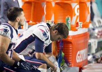 MIAMI GARDENS, FL - DECEMBER 11: New England Patriots Quarterback Tom Brady (12) looks down as he sits on the bench on the sidelines during the NFL football game between the New England Patriots and the Miami Dolphins on December 11, 2017, at the Hard Rock Stadium in Miami Gardens, FL. (Photo by Doug Murray/Icon Sportswire)