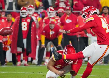 Dec 8, 2024; Kansas City, Missouri, USA; Kansas City Chiefs place kicker Matthew Wright (49) kicks the winning field goal against the Los Angeles Chargers during the second half at GEHA Field at Arrowhead Stadium. Mandatory Credit: Denny Medley-Imagn Images