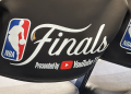 A featured image showing the NBA Finals logo on the back of a chair.