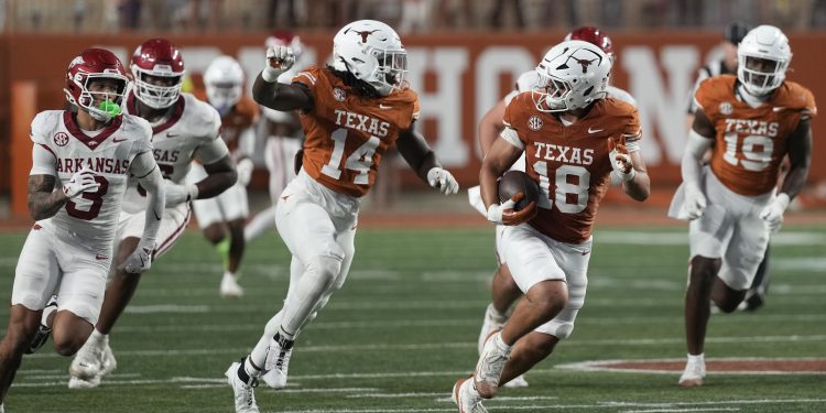 Nov 22, 2025; Austin, Texas, USA; Texas Longhorns linebacker Liona Lefau (18) runs for after recovering a fumble during the second half against the Arkansas Razorbacks at Darrell K Royal-Texas Memorial Stadium. Mandatory Credit: Scott Wachter-Imagn Images