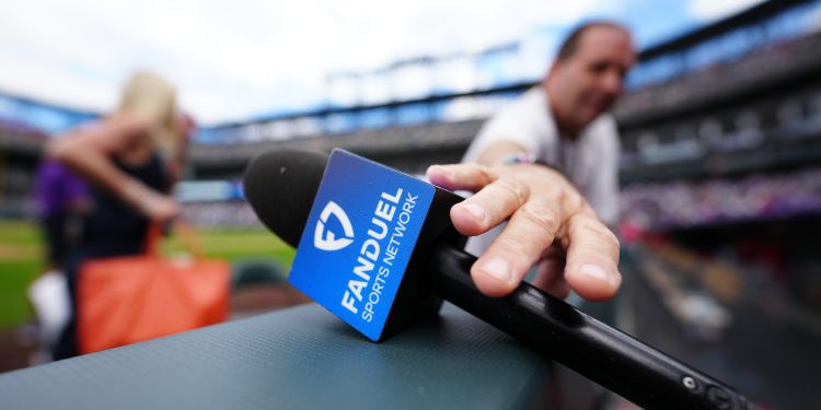 Sep 21, 2025; Denver, Colorado, USA; Detailed view of a Fanduel microphone jacket following the game between the Los Angeles Angels against theColorado Rockies at Coors Field. Mandatory Credit: Ron Chenoy-Imagn Images