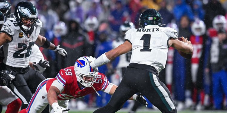 Dec 28, 2025; Orchard Park, New York, USA; Philadelphia Eagles quarterback Jalen Hurts (1) is pressured by Buffalo Bills linebacker Matt Milano (58) in the fourth quarter at Highmark Stadium. Mandatory Credit: Mark Konezny-Imagn Images