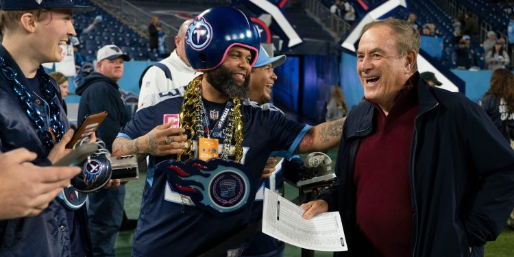 Broadcaster Al Michaels shares a laugh with Titans fans before a game between the Tennessee Titans and Dallas Cowboys at Nissan Stadium in Nashville, Tennessee on Thursday, Dec. 29, 2022.