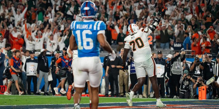 Miami Hurricanes offensive lineman Markel Bell (70) celebrates the game-winning touchdown with the crowd of Miami fans during the CFP Fiesta Bowl against Ole Miss at the State Farm Stadium, in Glendale, Ariz., on Thursday, Jan. 8, 2026.