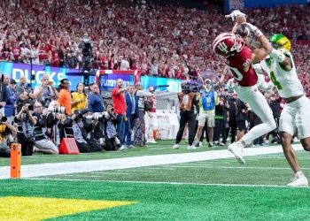 Indiana Hoosiers wide receiver Charlie Becker (80) makes a catch in front of Oregon Ducks defensive back Brandon Finney (4) for a touchdown Friday, Jan. 9, 2026, during the Peach Bowl and semifinal game of the College Football Playoff at Mercedes-Benz Stadium in Atlanta.