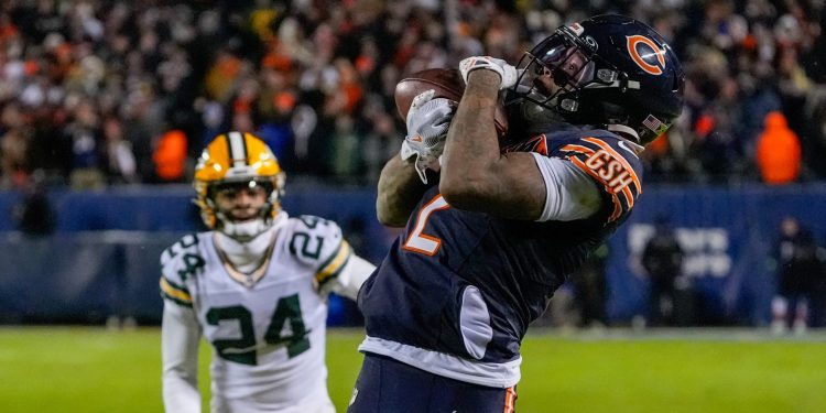Jan 10, 2026; Chicago, IL, USA;  Chicago Bears wide receiver DJ Moore (2) makes the eventual game winning touchdown catch against the Green Bay Packers during the second half of an NFC Wild Card Round game at Soldier Field. Mandatory Credit: David Banks-Imagn Images
