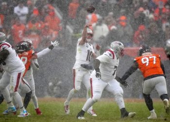 Jan 25, 2026; Denver, CO, USA; New England Patriots quarterback Drake Maye (10) drops back to pass against the Denver Broncos during the second half in the 2026 AFC Championship Game at Empower Field at Mile High. Mandatory Credit: Ron Chenoy-Imagn Images