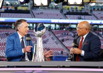 3DN4YC5 Santa Clara, United States. 08th Feb, 2026. NBC broadcast team members Cris Collinsnworth, left, and Mike Tirico, right, on set with the Vince Lombardi Trophy before the start of Super Bowl LX at at Levi's Stadium in Santa Clara, California on Sunday, February 8, 2026. Photo by John Angelillo/UPI Credit: UPI/Alamy Live News