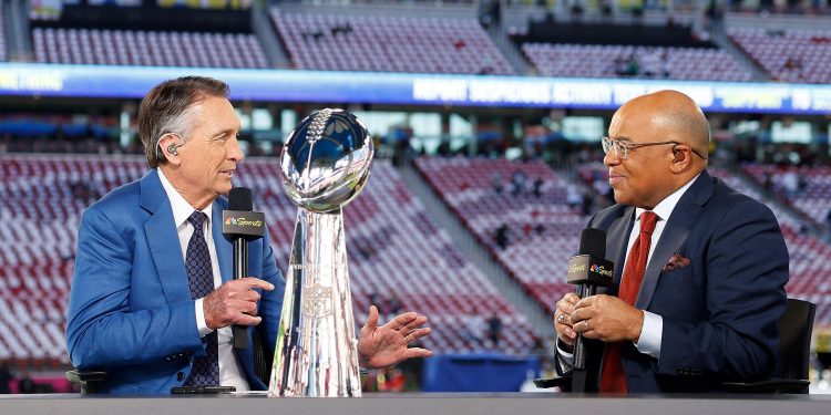 3DN4YC5 Santa Clara, United States. 08th Feb, 2026. NBC broadcast team members Cris Collinsnworth, left, and Mike Tirico, right, on set with the Vince Lombardi Trophy before the start of Super Bowl LX at at Levi's Stadium in Santa Clara, California on Sunday, February 8, 2026. Photo by John Angelillo/UPI Credit: UPI/Alamy Live News