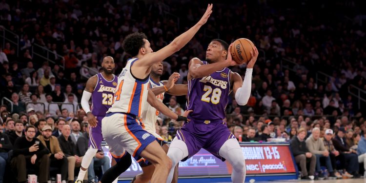 Feb 1, 2026; New York, New York, USA; Los Angeles Lakers forward Rui Hachimura (28) looks to pass the ball against New York Knicks guard Landry Shamet (44) and forward OG Anunoby (8) during the third quarter at Madison Square Garden. Mandatory Credit: Brad Penner-Imagn Images