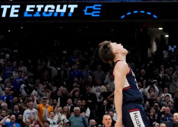 UConn guard Braylon Mullins (24) celebrates after a basket against Duke during the second half in the Elite Eight of the NCAA college basketball tournament, Sunday, March 29, 2026, in Washington. (AP Photo/Stephanie Scarbrough)