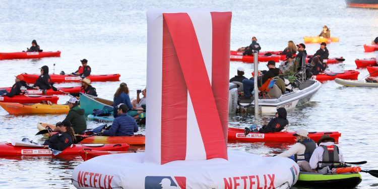 SAN FRANCISCO, CALIFORNIA - MARCH 25: Netflix branded floats, fans and kayakers on Netflix branded kayaks are seen during the MLB Opening Night Game: Yankees vs. Giants, at Momo's on March 25, 2026 in San Francisco, California. (Photo by Kelly Sullivan/Getty Images for Netflix)