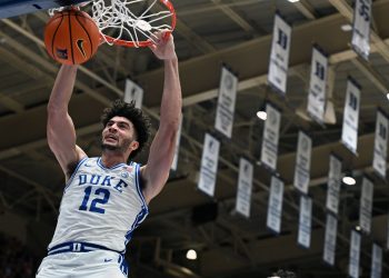 Mar 7, 2026; Durham, North Carolina, USA; Duke Blue Devils forward Cameron Boozer (12) dunks during the second half against the North Carolina Tar Heels at Cameron Indoor Stadium.  The Duke Blue Devils won 76-61. Mandatory Credit: Rob Kinnan-Imagn Images