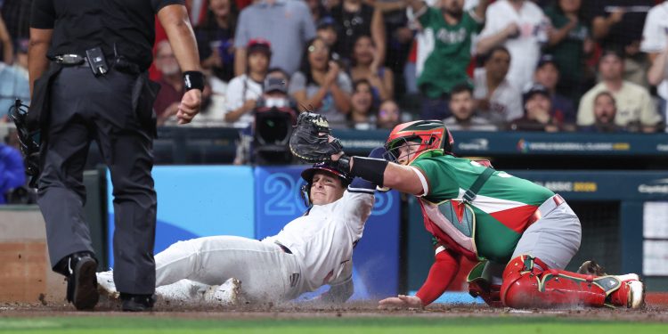 Mar 9, 2026; Houston, TX, United States; United States infielder Brice Turang (13) attempts to slide home in the second inning against Mexico at Daikin Park. Mandatory Credit: Troy Taormina-Imagn Images