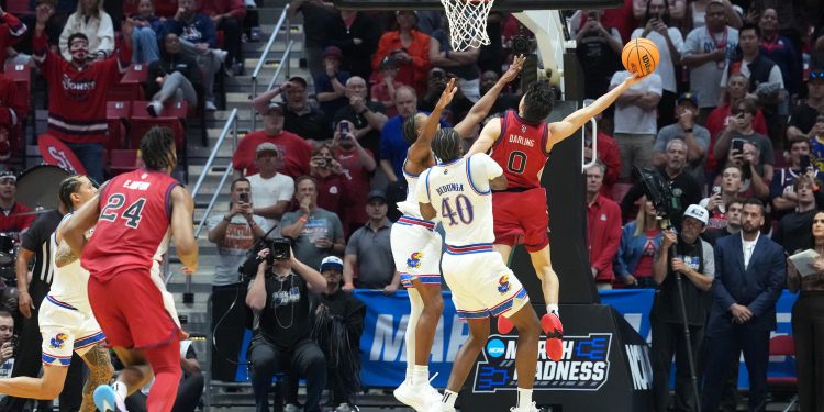 Mar 22, 2026; San Diego, CA, USA; St. John's Red Storm guard Dylan Darling (0) shoots the game-winning shot against the Kansas Jayhawks in the second half during a second round game of the men's 2026 NCAA Tournament at Viejas Arena. Mandatory Credit: Kirby Lee-Imagn Images