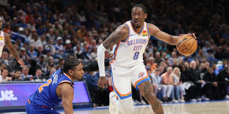 Oklahoma City Thunder guard Jalen Williams (8) drives against New York Knicks guard Miles McBride (2) during the second half of an NBA basketball game Sunday, March 29, 2026, in Oklahoma City. (AP Photo/Nate Billings)