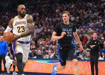 Los Angeles Lakers forward LeBron James (23) drives against Dallas Mavericks forward Cooper Flagg (32) during the first half of an NBA basketball game in Dallas, Sunday, April 5, 2026. (AP Photo/LM Otero)