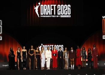 WNBA prospects pose on stage before the WNBA basketball draft Monday, April 13, 2026, in New York. (AP Photo/Pamela Smith)