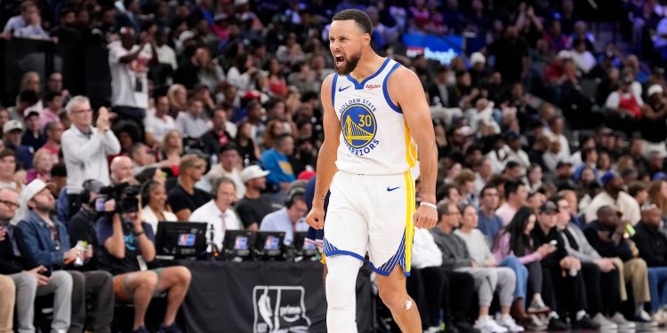 Golden State Warriors guard Stephen Curry celebrates during the second half of an NBA play-in tournament basketball game against the Los Angeles Clippers, Wednesday, April 15, 2026, in Inglewood, Calif. (AP Photo/Mark J. Terrill)