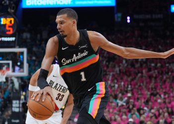 San Antonio Spurs forward Victor Wembanyama (1) drives past Portland Trail Blazers forward Toumani Camara (33) during the second half in Game 1 of a first-round NBA playoffs basketball series in San Antonio, Sunday, April 19, 2026. (AP Photo/Eric Gay)