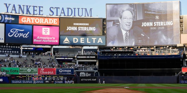 A scoreboard displays late former New York Yankees broadcaster John Sterling during a tribute to Sterling ahead of a baseball game between the New York Yankees and the Baltimore Orioles, Monday, May 4, 2026, in New York. (AP Photo/Yuki Iwamura)