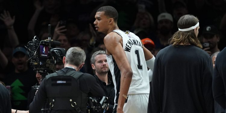San Antonio Spurs forward Victor Wembanyama (1) reacts after he was ejected for a flagrant foul during the first half of Game 4 of an NBA basketball second-round playoffs series against the Minnesota Timberwolves in Minneapolis, Sunday, May 10, 2026. (AP Photo/Abbie Parr)