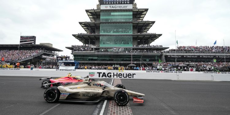 Felix Rosenqvist, foreground, of Sweden, beats David Malukas to the finish line to win the Indianapolis 500 auto race at Indianapolis Motor Speedway in Indianapolis, Sunday, May 24, 2026. (AP Photo/AJ Mast)