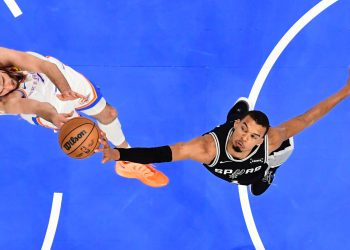 San Antonio Spurs forward Victor Wembanyama, right, blocks a shot by Oklahoma City Thunder center Chet Holmgren during the first half in Game 5 in the Western Conference finals NBA basketball playoffs series, Tuesday, May 26, 2026, in Oklahoma City. (AP Photo/Gerald Leong)