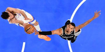San Antonio Spurs forward Victor Wembanyama, right, blocks a shot by Oklahoma City Thunder center Chet Holmgren during the first half in Game 5 in the Western Conference finals NBA basketball playoffs series, Tuesday, May 26, 2026, in Oklahoma City. (AP Photo/Gerald Leong)