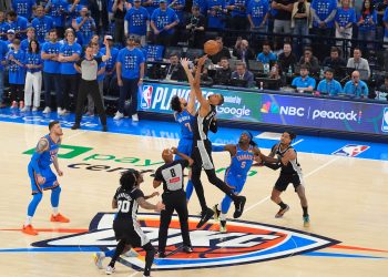 Oklahoma City Thunder center Chet Holmgren (7) battles with San Antonio Spurs forward Victor Wembanyama (1) during the opening tipoff during the first half of Game 7 of the Western Conference finals of the NBA basketball playoffs series Saturday, May 30, 2026, in Oklahoma City. (AP Photo/Tony Gutierrez)