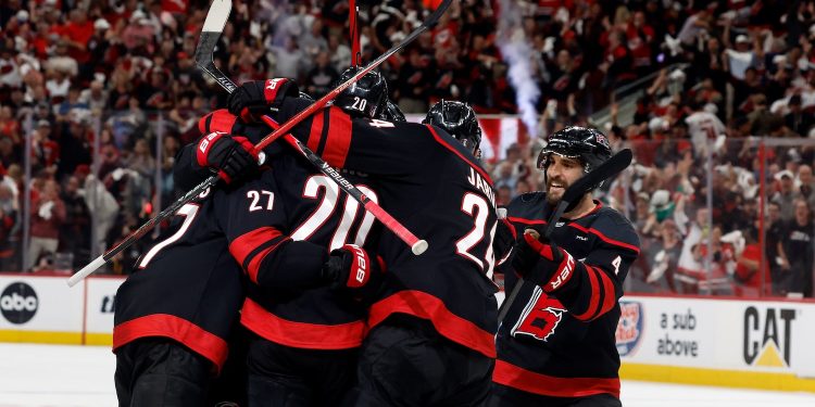 Carolina Hurricanes players celebrate after a goal by Andrei Svechnikov during the second period in Game 5 of the NHL hockey Stanley Cup Final series against the Vegas Golden Knights in Raleigh, N.C., Thursday, June 11, 2026. (AP Photo/Karl DeBlaker)