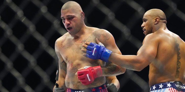 Alex Pereira, left, fights Ciryl Gane during their interim heavyweight title bout at UFC Freedom 250 on the South Lawn of the White House, Monday, June 15, 2026, in Washington. (AP Photo/Alex Brandon)