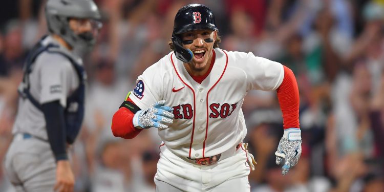 Boston Red Sox's Jarren Duran, right, celebrates in front of New York Yankees catcher Austin Wells, left, after hitting a walk-off one-run single in the tenth inning of a baseball game, Sunday, June 28, 2026, in Boston. (AP Photo/Steven Senne)