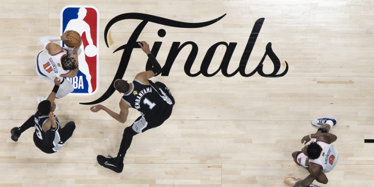 San Antonio, TX - June 3, 2026 - Frost Bank Center: Jalen Brunson (11), OG Anunoby (8) of the New York Knicks and Keldon Johnson (3), Victor Wembanyama (1), Devin Vassell (24) of the San Antonio Spurs during game one of the 2026 NBA Finals.
(Photo by Ben Solomon / ESPN Images)
