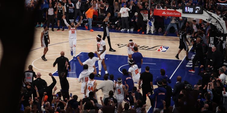 New York, NY - June 10, 2026 - Madison Square Garden: Karl-Anthony Towns (32), Mitchell Robinson (23), and Josh Hart (3) of the New York Knicks after winning game four of the 2026 NBA Finals.
(Photo by Marcus Stevens / ESPN Images)