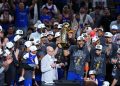 San Antonio, TX - June 13, 2026 - Frost Bank Center: Ernie Johnson with Karl-Anthony Towns (32) of the New York Knicks holding the Larry O'Brien Championship Trophy after winning game five and the 2026 NBA Finals.
(Photo by Rich Storry / ESPN Images)