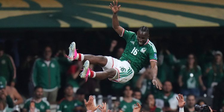 Mexico's Julian Quinones (16) is lifted in the air as he celebrates his team victory with his teammates during the World Cup round of 32 soccer match between Mexico and Ecuador in Mexico City, Tuesday, June 30, 2026. (AP Photo/Eduardo Verdugo)