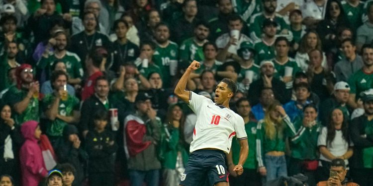 England's Jude Bellingham celebrates after scoring his side's opening goal during the World Cup round of 16 soccer match between Mexico and England in Mexico City, Sunday, July 5, 2026. (AP Photo/Ricardo Mazalan)