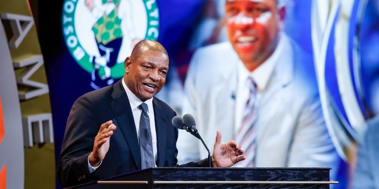 Former NBA All-Star point guard Doc Rivers speaks during his enshrinement at the 2026 Naismith Basketball Hall of Fame induction ceremony Saturday, Aug. 15, 2026, in Springfield, Mass. (AP Photo/Rusty Jones)