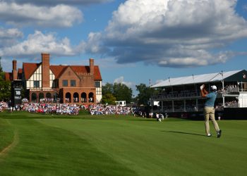 Scottie Scheffler hits from the fairway on the 18th hole during the final round of the PGA Tour Championship golf tournament Sunday, Aug. 30, 2026, in Atlanta. (AP Photo/Colin Hubbard)