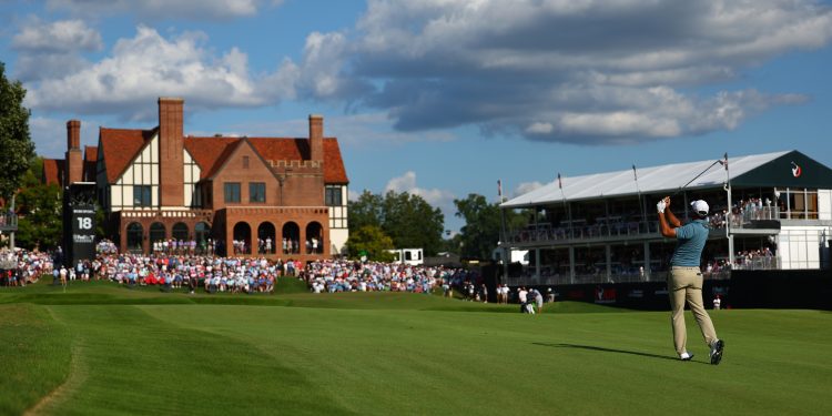 Scottie Scheffler hits from the fairway on the 18th hole during the final round of the PGA Tour Championship golf tournament Sunday, Aug. 30, 2026, in Atlanta. (AP Photo/Colin Hubbard)