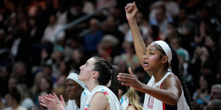 Caitlin Clark of the United States,, left, and Angel Reese react during the Women's Basketball World Cup final match between the United States and France in Berlin, Sunday, Sept. 13, 2026. (AP Photo/Ebrahim Noroozi)
