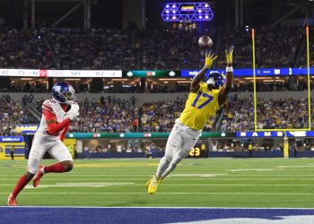Los Angeles Rams wide receiver Davante Adams (17) makes a touchdown catch past New York Giants cornerback Colton Hood (12) during the second half of an NFL football game in Inglewood, Calif., Monday, Sept. 21, 2026. (AP Photo/Katie Chin)