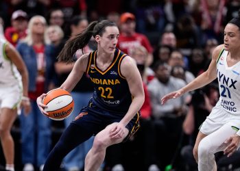 Minnesota Lynx guard Kayla McBride (21) defends Indiana Fever guard Caitlin Clark (22) in the first half of a WNBA basketball game in Indianapolis, Tuesday, Sept. 22, 2026. (AP Photo/Michael Conroy)