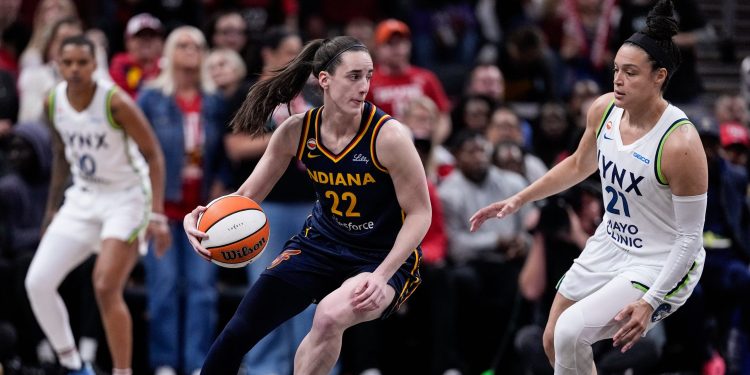 Minnesota Lynx guard Kayla McBride (21) defends Indiana Fever guard Caitlin Clark (22) in the first half of a WNBA basketball game in Indianapolis, Tuesday, Sept. 22, 2026. (AP Photo/Michael Conroy)