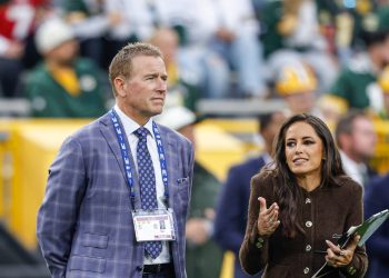 Thursday night football announcers Kirk Herbstreit, left and Kaylee Hartung on the field before an NFL football game between the Green Bay Packers and the Atlanta Falcons in Green Bay, Wis., Thursday, Sept. 24, 2026. (AP Photo/Jeffrey Phelps)