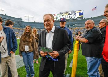 Al Michaels, play by play sportscaster walks on the field before an NFL football game between the Green Bay Packers and the Atlanta Falcons in Green Bay, Wis., Thursday, Sept. 24, 2026. (AP Photo/Jeffrey Phelps)