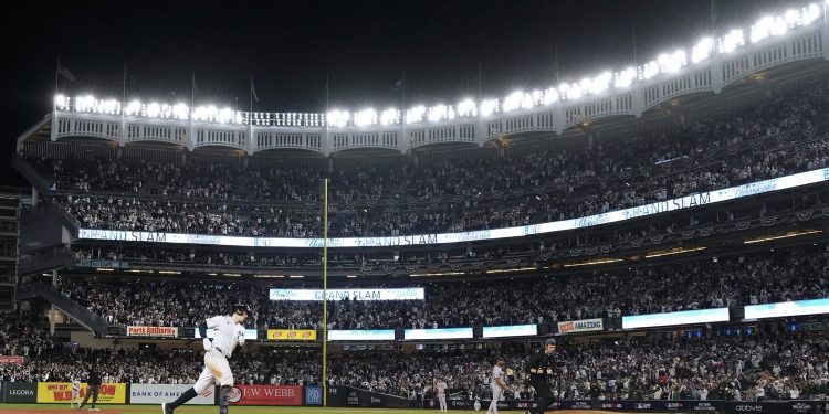 New York Yankees' Ben Rice runs the bases after hitting a grand slam off Boston Red Sox pitcher Brayan Bello during the eighth inning in Game 1 of baseball's American League Wild Card Series, Tuesday, Sept. 29, 2026, in New York. (AP Photo/Frank Franklin II)