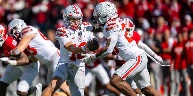 Ohio State quarterback Julian Sayin (10) hands off to running back Bo Jackson (25) during the first half of an NCAA college football game against Indiana, Saturday, Oct. 17, 2026, in Bloomington, Ind. (AP Photo/Doug McSchooler)